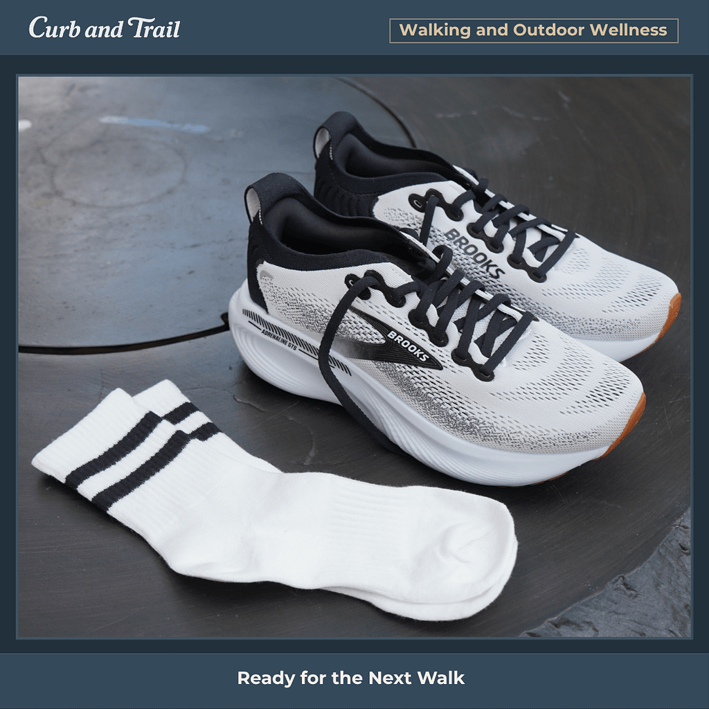 Photo of Brooks Adrenaline shoes sitting on a table outdoors with socks laid next to them, in a photo frame