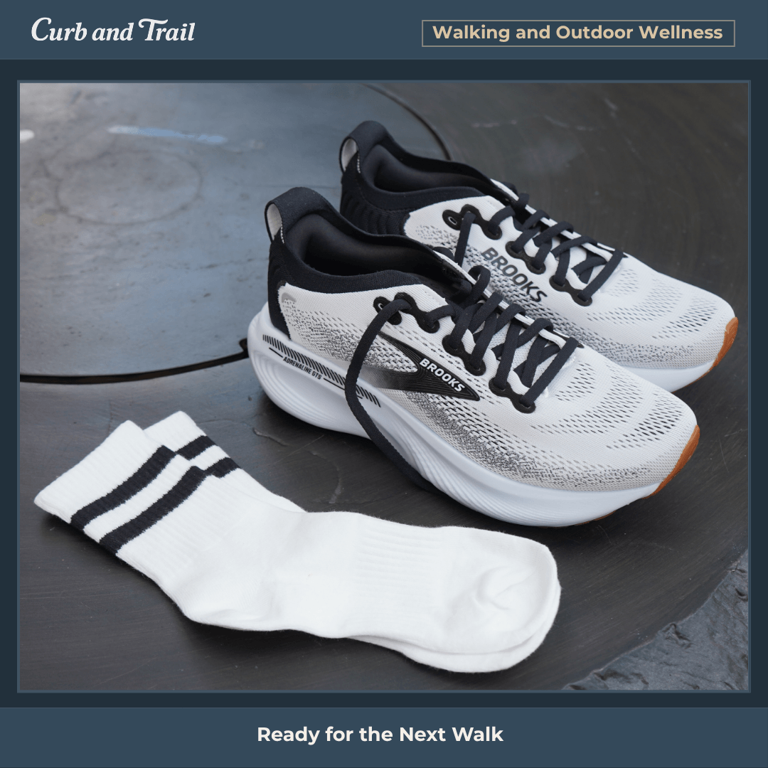 Photo of Brooks Adrenaline shoes sitting on a table outdoors with socks laid next to them, in a photo frame